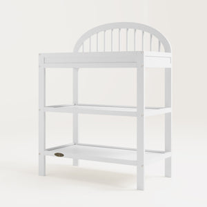 angled view of white changing table