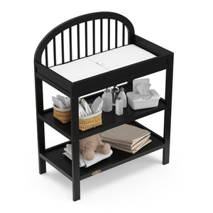 top view of black changing table with nursery supplies 