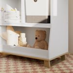 storkcraft modern convertible changing table white with driftwood closeup of storage and base in nursery with baby items inside