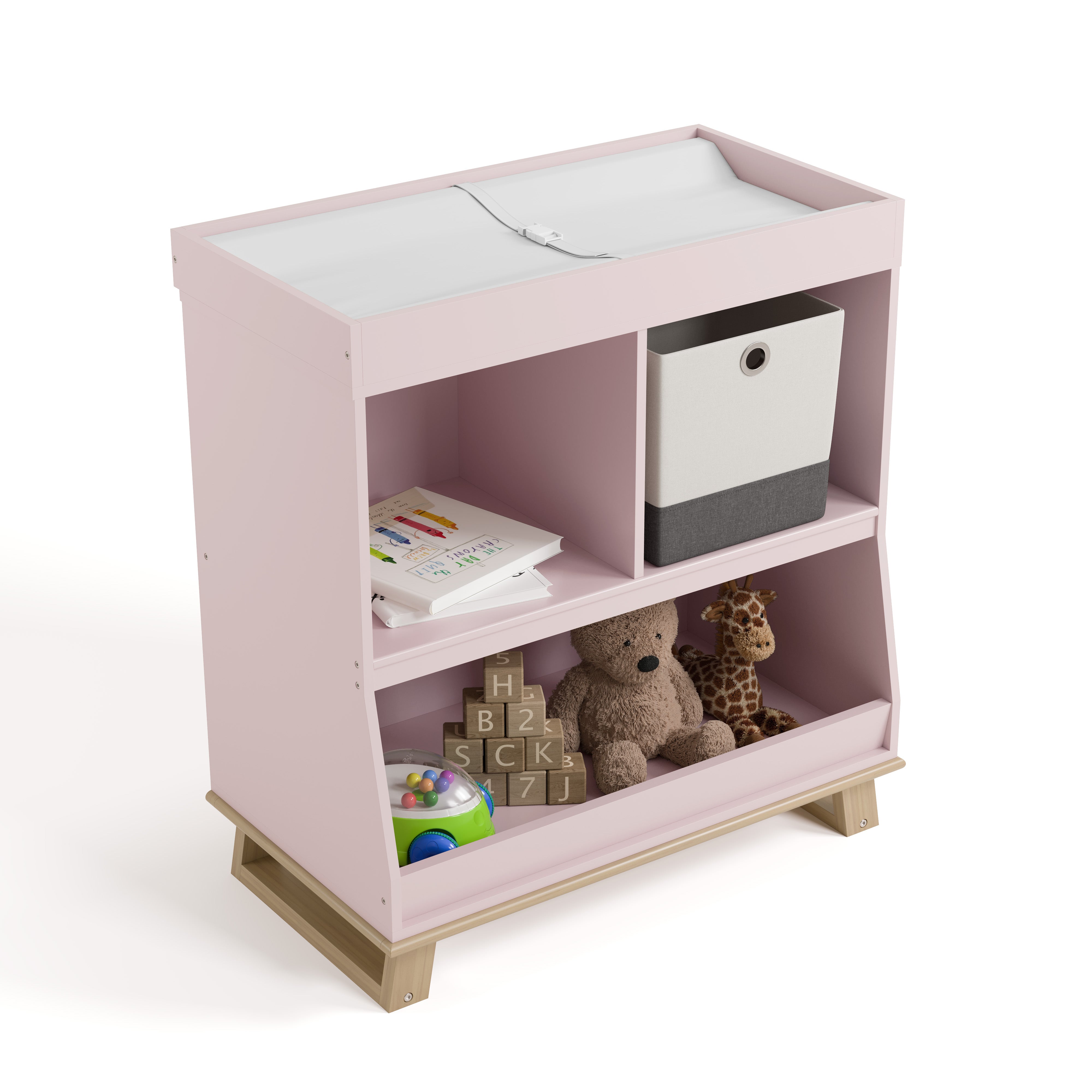 storkcraft modern convertible changing table blush with driftwood top view with changing pad and baby items inside storage cubbies