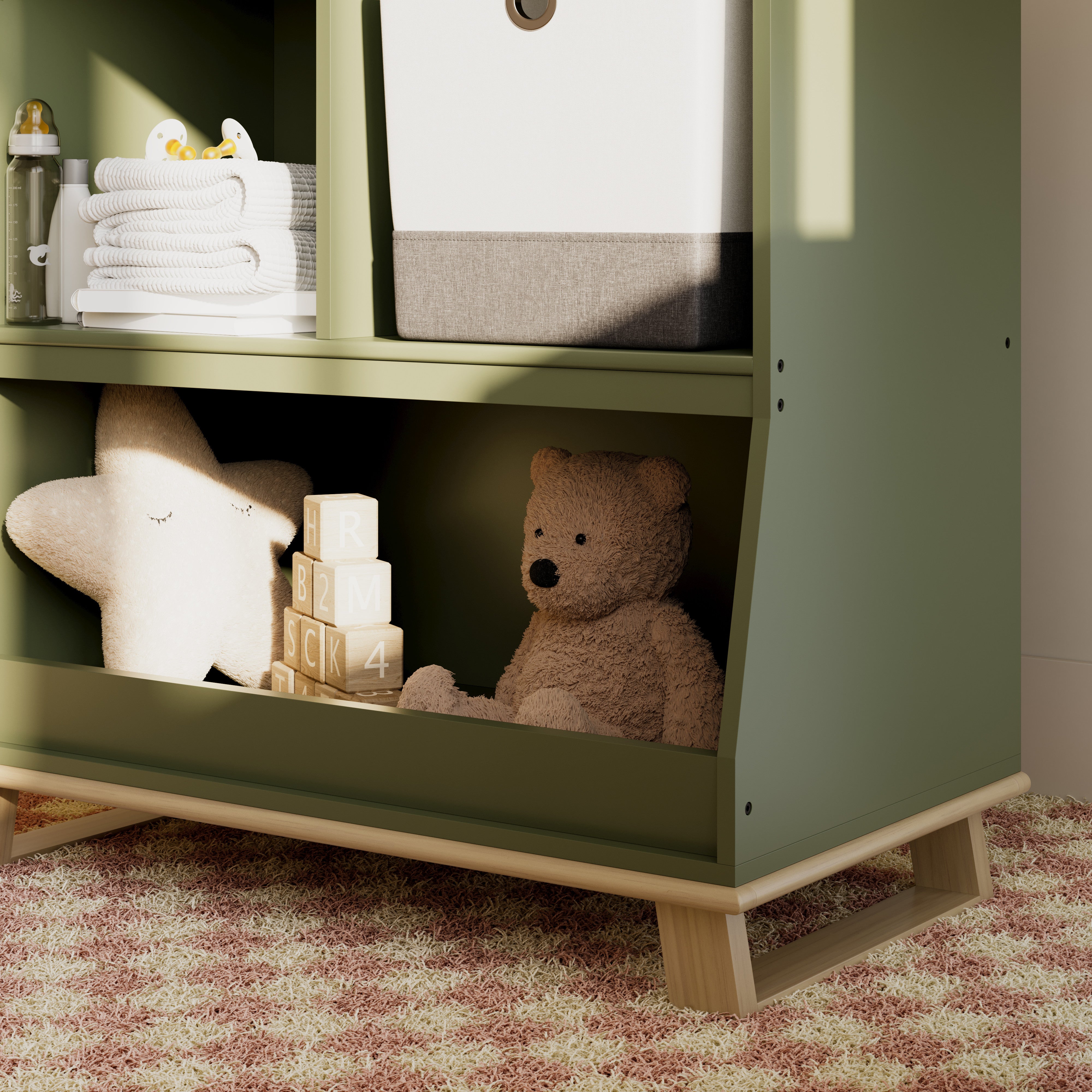storkcraft modern convertible changing table olive with driftwood closeup of storage and base in nursery with baby items inside