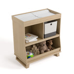 storkcraft modern convertible changing table driftwood top view with changing pad and baby items inside storage cubbies