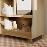 storkcraft modern convertible changing table driftwood closeup of storage and base in nursery with baby items inside