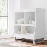 modern convertible white with pebble gray changing table in nursery with changing essentials in shelves