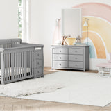 storkcraft portofino pebble gray crib and changer in nursery with kenton 6 pebble gray dresser and tuscany white with pink glider