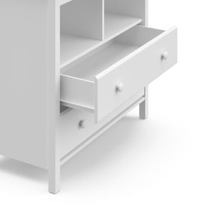 Close-up view of open drawer of white 2 drawer chest with changing topper