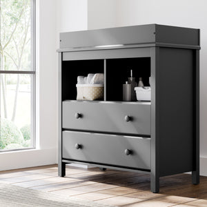 Gray 2 drawer chest with changing topper in nursery