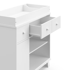 White changing table with one drawer open top view