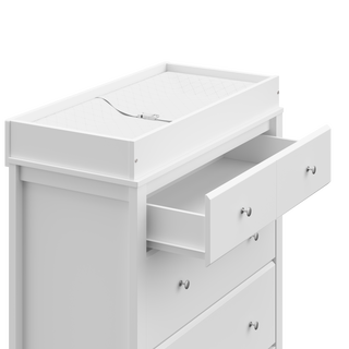 close-up view of white chest with open drawer