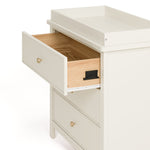 sasha 3 drawer chest with topper in frosted oat finish angle side view of top drawer open showing interlocking drawer mechanism