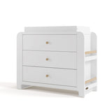 Angle view of Read-with-Me 3 drawer chest with bookshelves and changing topper in white with driftwood