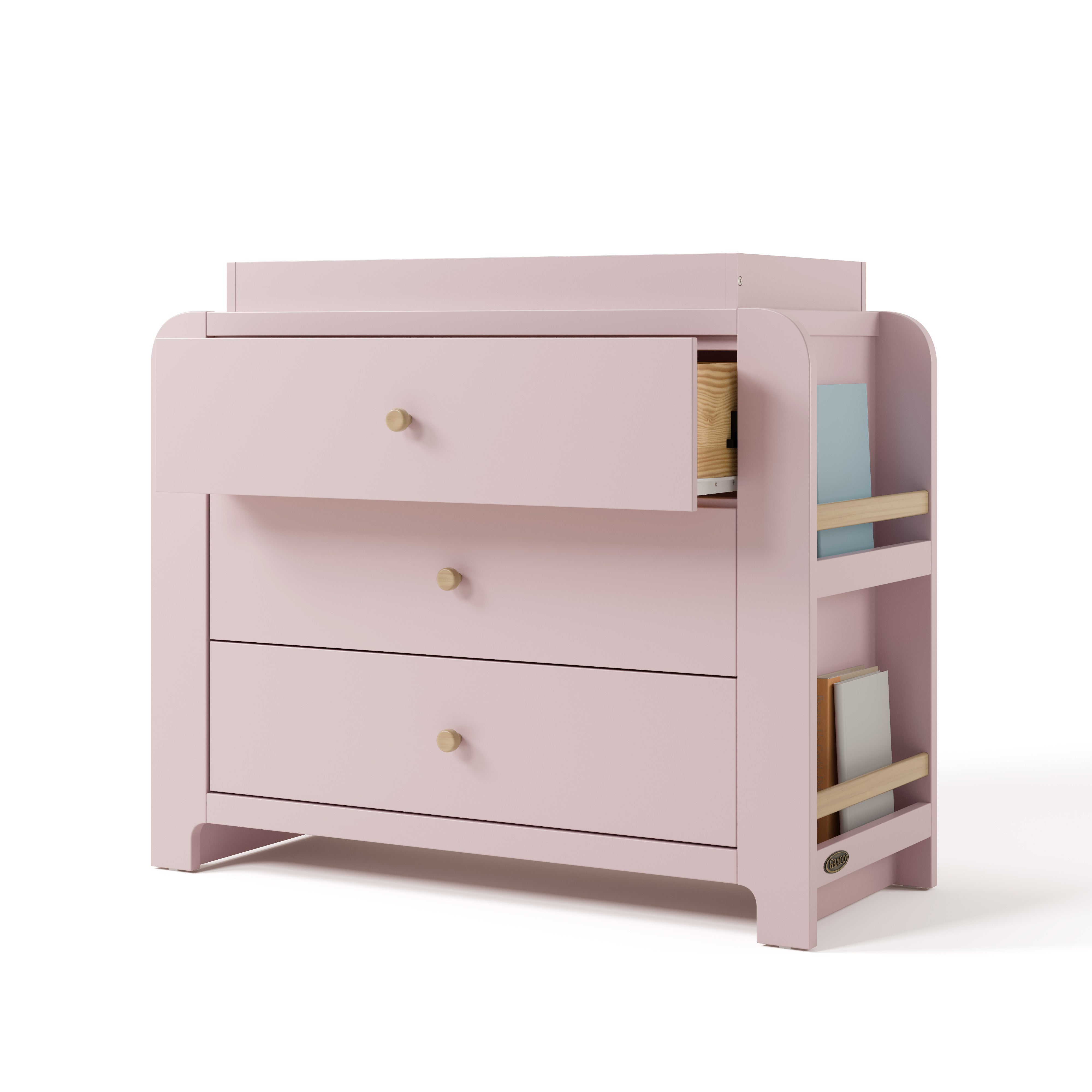Angle view of Read-with-Me 3 drawer chest with bookshelves and changing topper in blush with driftwood with top drawer open