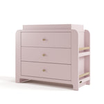 Angle view of Read-with-Me 3 drawer chest with bookshelves and changing topper in blush with driftwood