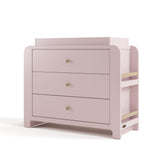 Angle view of Read-with-Me 3 drawer chest with bookshelves and changing topper in blush with driftwood