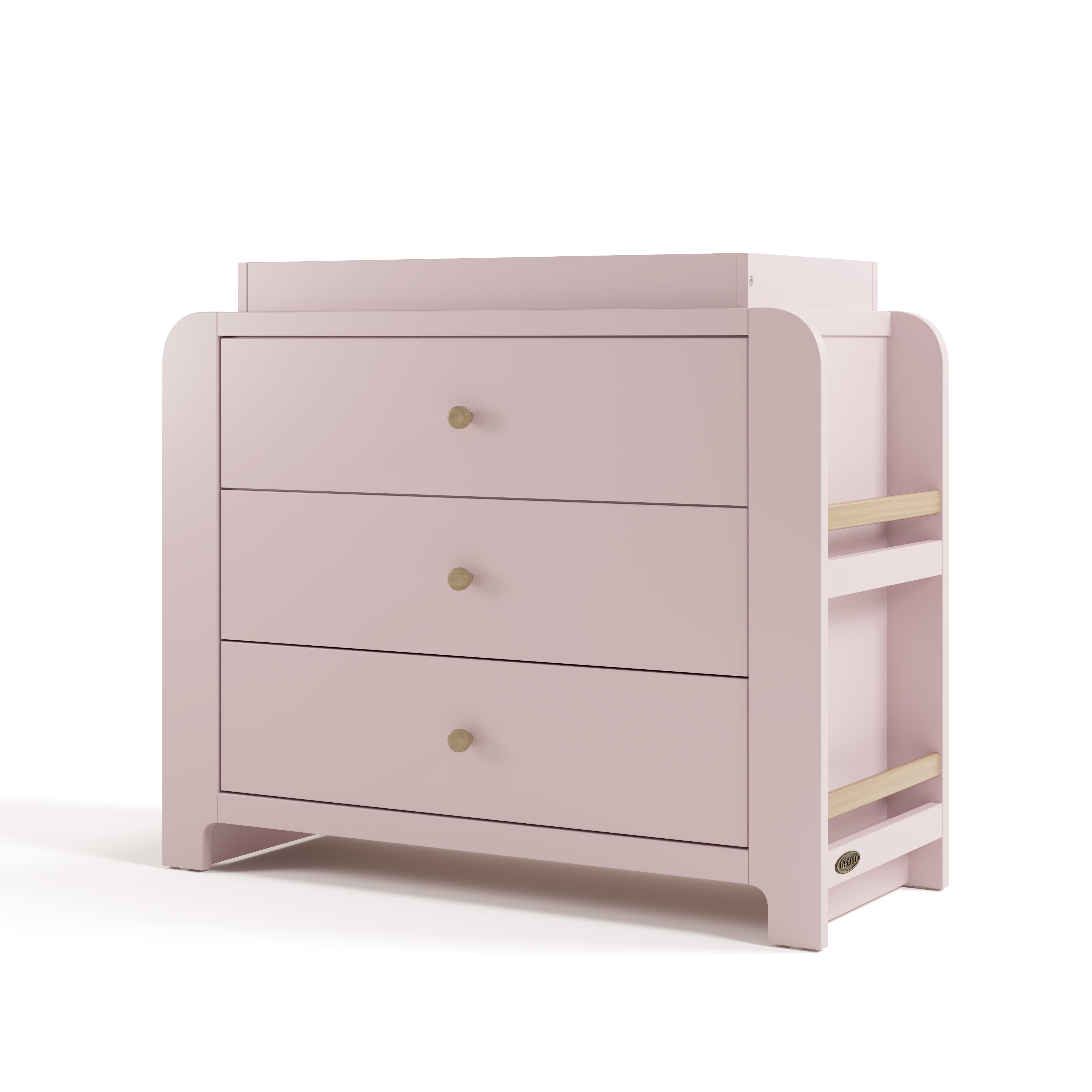 Angle view of Read-with-Me 3 drawer chest with bookshelves and changing topper in blush with driftwood