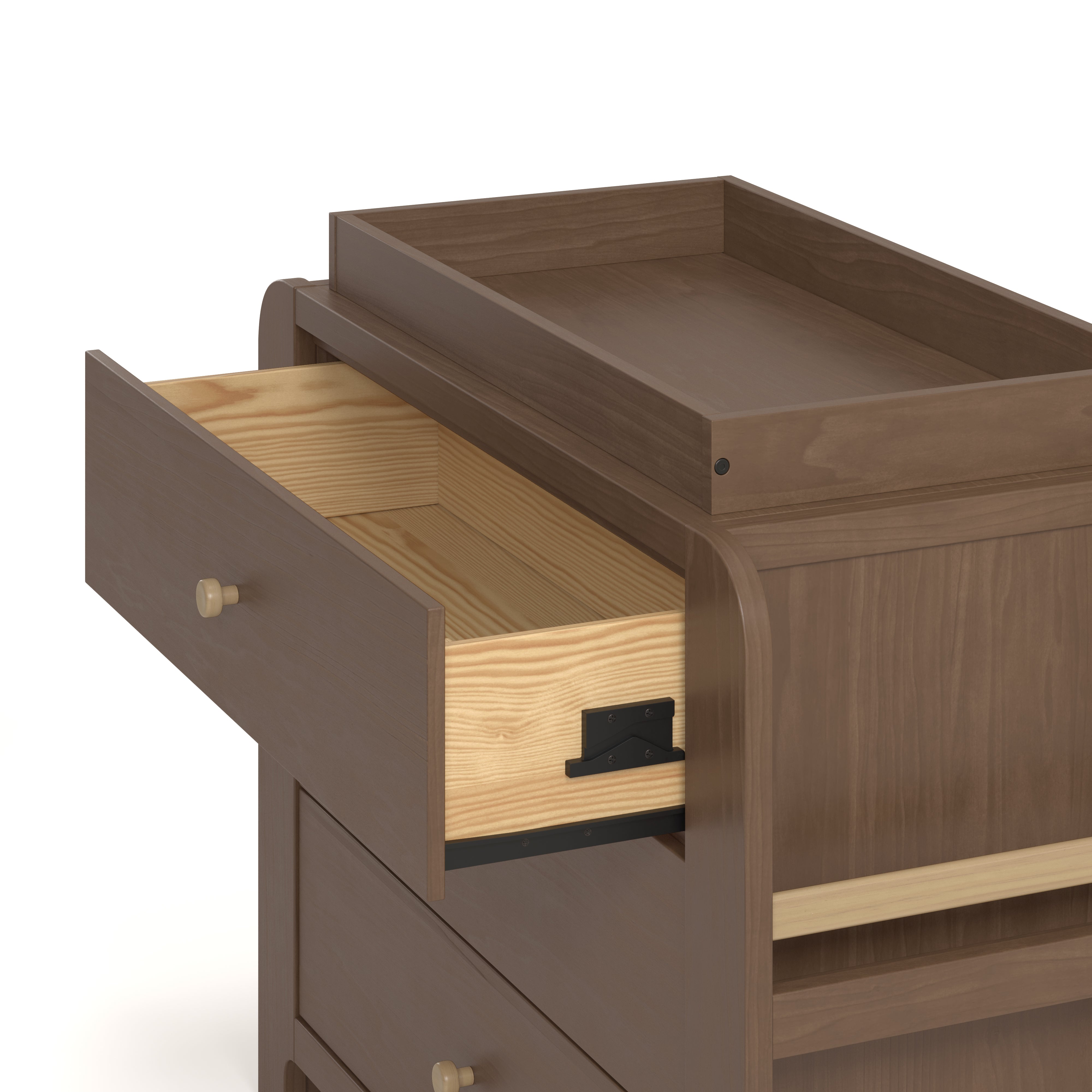Close up drawer view of Read-with-Me 3 drawer chest with bookshelves and changing topper in hazelnut with driftwood with top drawer open showing interlocking drawer mechanism