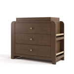 Angle view of Read-with-Me 3 drawer chest with bookshelves and changing topper in hazelnut with driftwood
