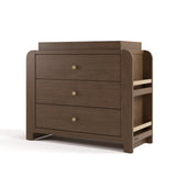 Angle view of Read-with-Me 3 drawer chest with bookshelves and changing topper in hazelnut with driftwood