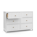 Angled view of white 6 drawer dresser with open drawer