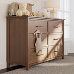 classic hazelnut 6 drawer dresser in nursery
