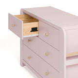 Angle view of Read-with-Me 6 drawer dresser in blush with driftwood with top left drawer open showing interlocking drawer mechanism