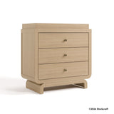 Santorini driftwood 3 drawer chest with changing topper with 2024 Storkcraft copyright on bottom right