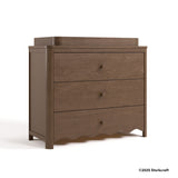 Casablanca hazelnut 3 drawer chest with changing topper with 2025 Storkcraft copyright on bottom right