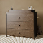 Casablanca hazelnut 3 drawer chest with topper nursery shot with changing essentials