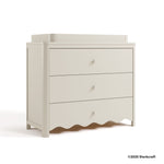 Casablanca frosted oat 3 drawer chest with changing topper with 2025 Storkcraft copyright on bottom right