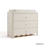 Casablanca frosted oat 3 drawer chest with changing topper with 2025 Storkcraft copyright on bottom right