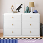 santos 6 drawer white with driftwood dresser in nursery with storkcraftnext written on bottom