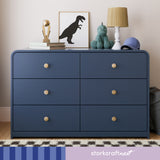 santos 6 drawer midnight blue with driftwood dresser in nursery with storkcraftnext written on bottom