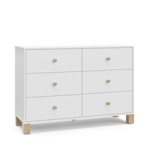 Angled view of white dresser with driftwood knobs and base