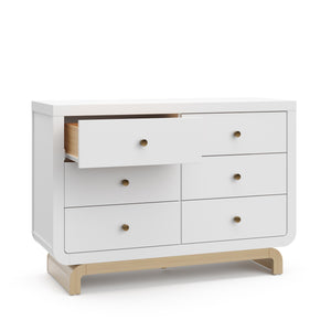 Angled view of white 6 drawer dresser with driftwood base with 1 open drawer