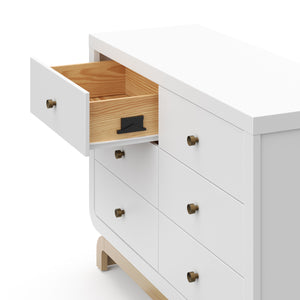 Top view of white 6 drawer dresser with driftwood base with 1 open drawer showing interlocking drawing system