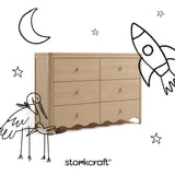 Storkcraft Casablanca driftwood 6 drawer dresser angle view with black cartoon drawings