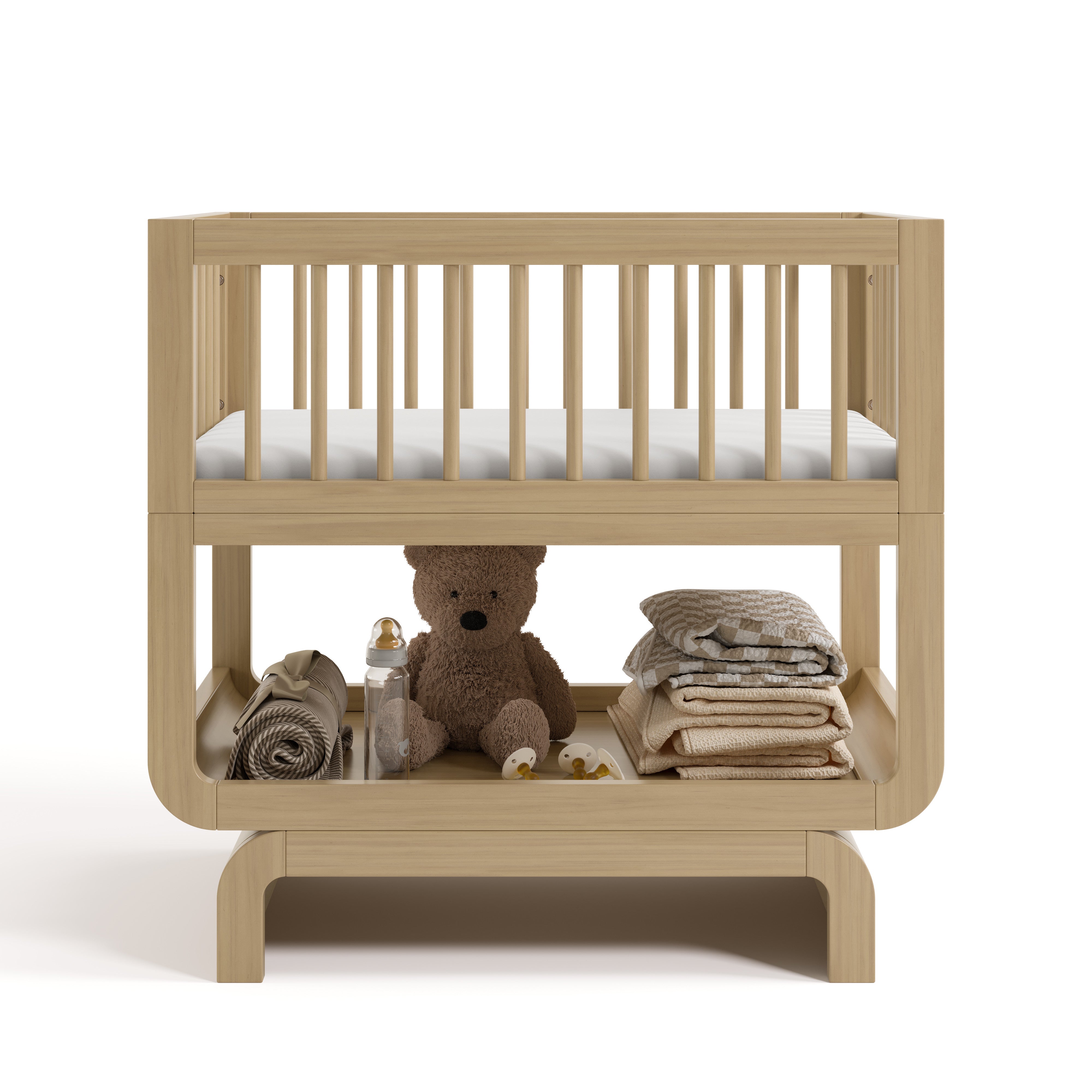 Santorini driftwood bassinet front view with baby items on bottom