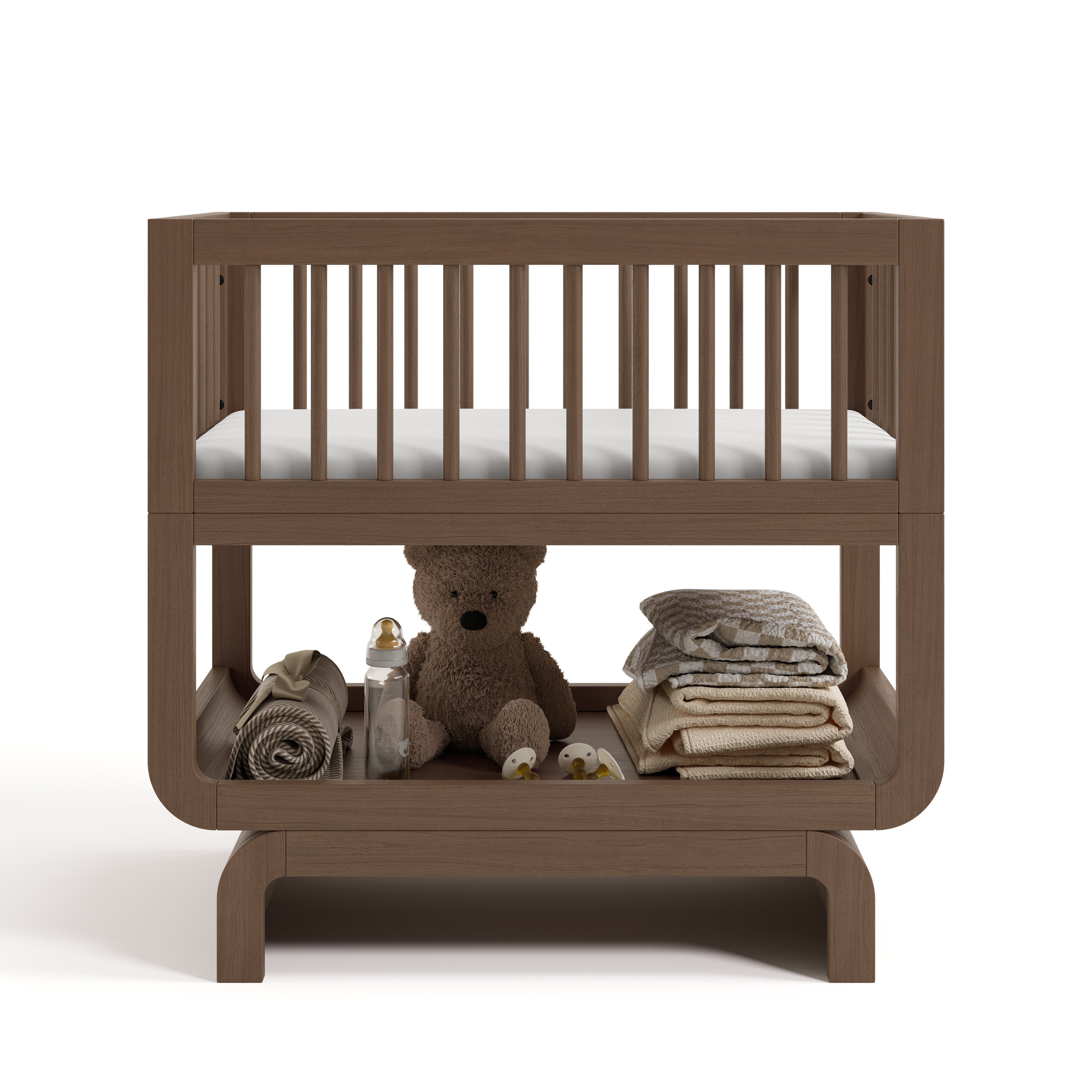 Santorini hazelnut bassinet front view with baby items on bottom