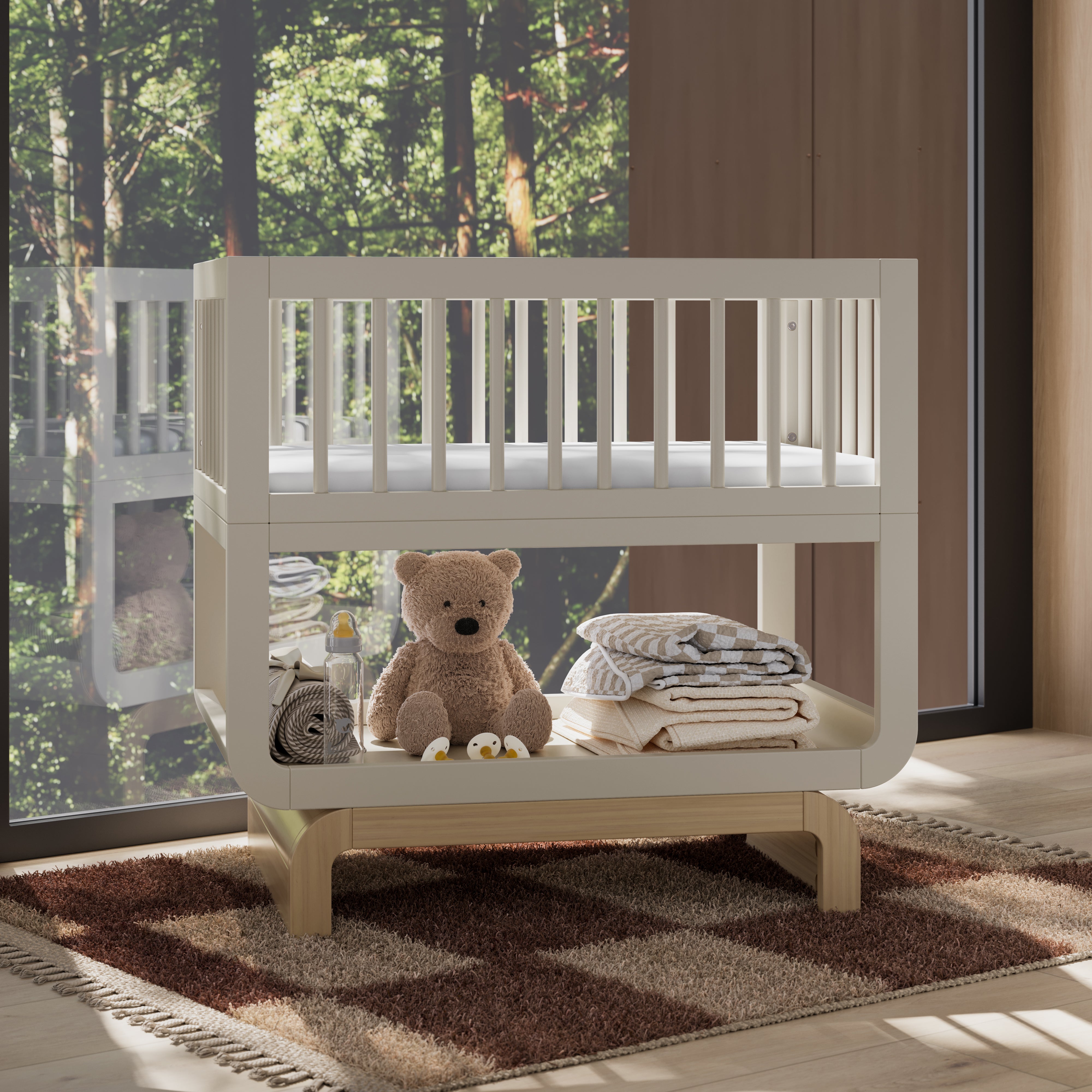 Santorini frosted oat with driftwood bassinet in nursery