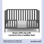 Gray crib converted into a toddler bed with overlay text highlighting product features