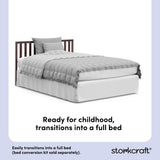 Espresso crib converted into a twin bed, with overlay text highlighting product features.