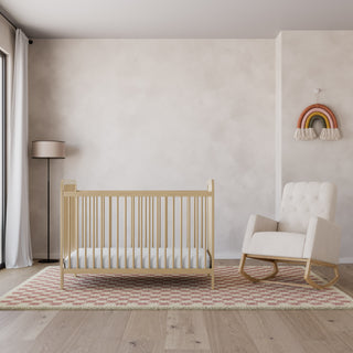Driftwood crib with ivory and natural base rocking chair in nursery