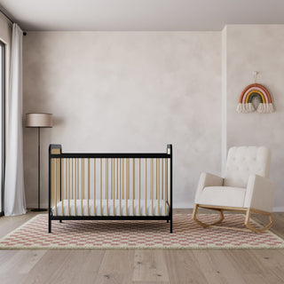 Black with Driftwood crib with ivory and natural base rocking chair in nursery