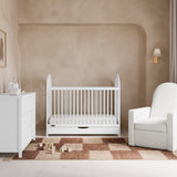 Olivia white crib with drawer in a nursery