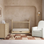 Olivia driftwood crib with drawer in a nursery