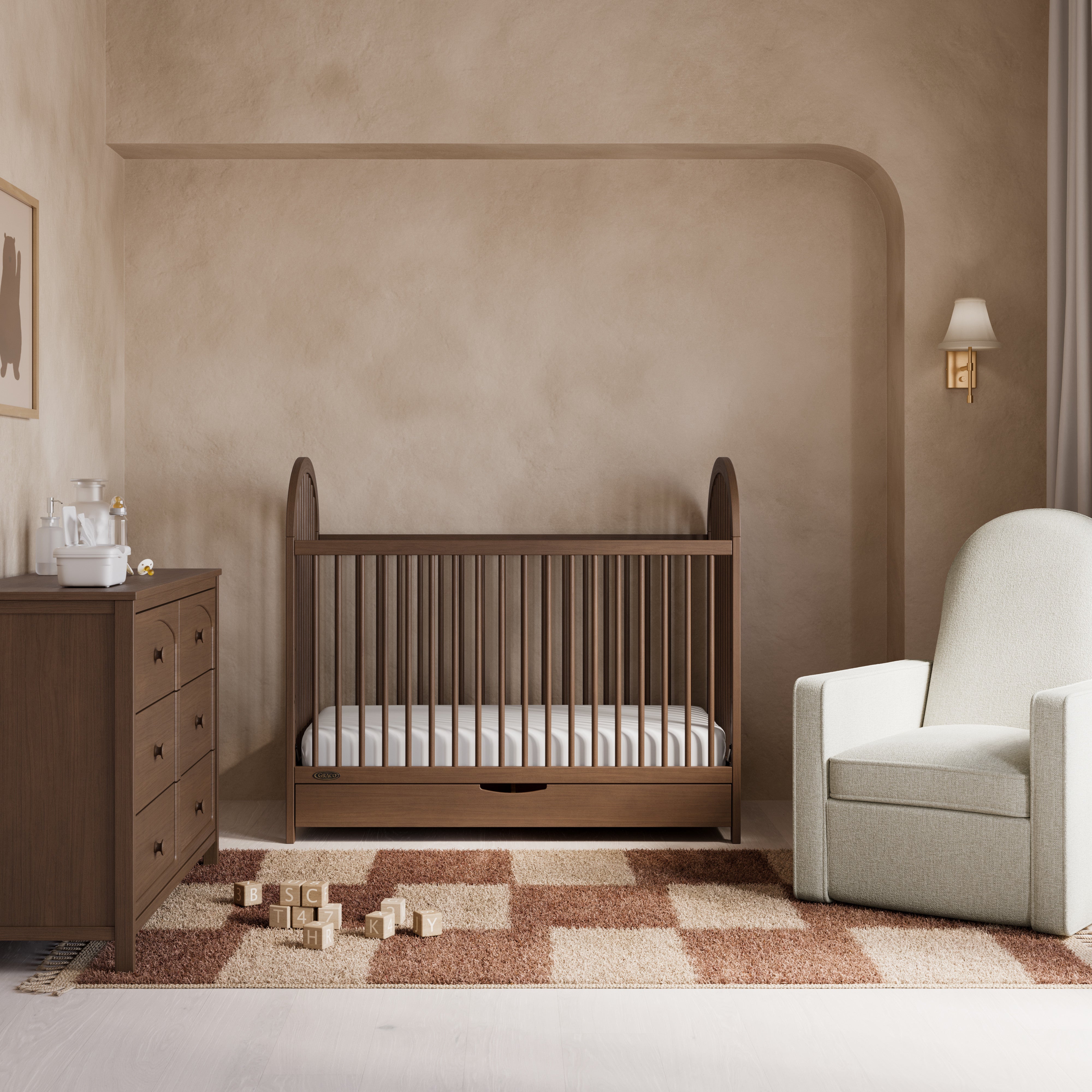 Olivia hazelnut crib with drawer in a nursery
