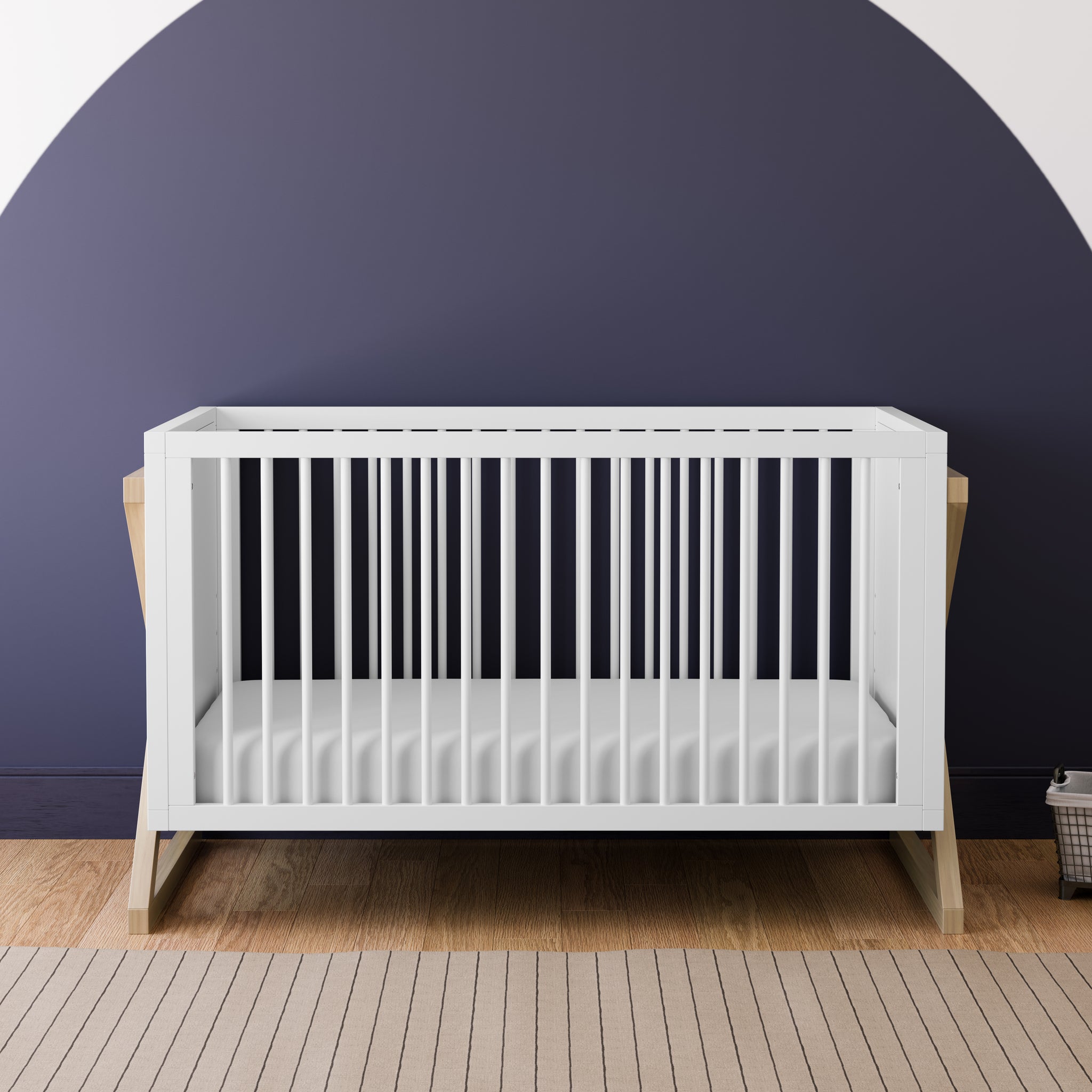 white and driftwood crib in nursery