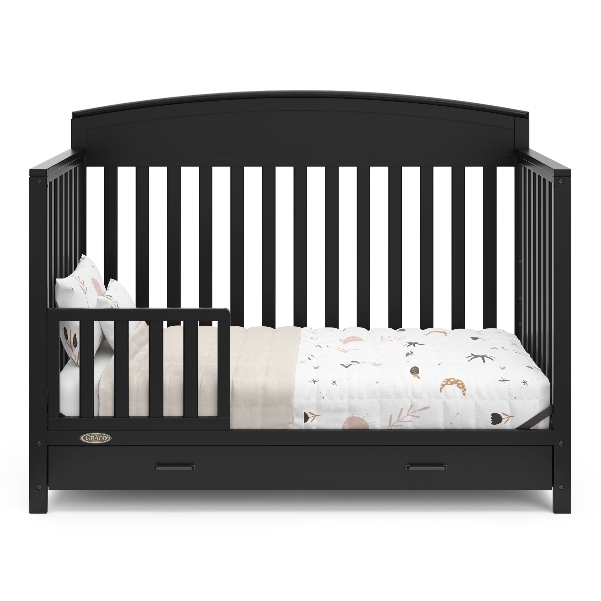 black crib with drawer in toddler bed conversion with one safety guardrail