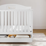 graco story white crib with drawer in nursery