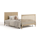 Hadley driftwood crib and changer converted to full-size bed with footboard